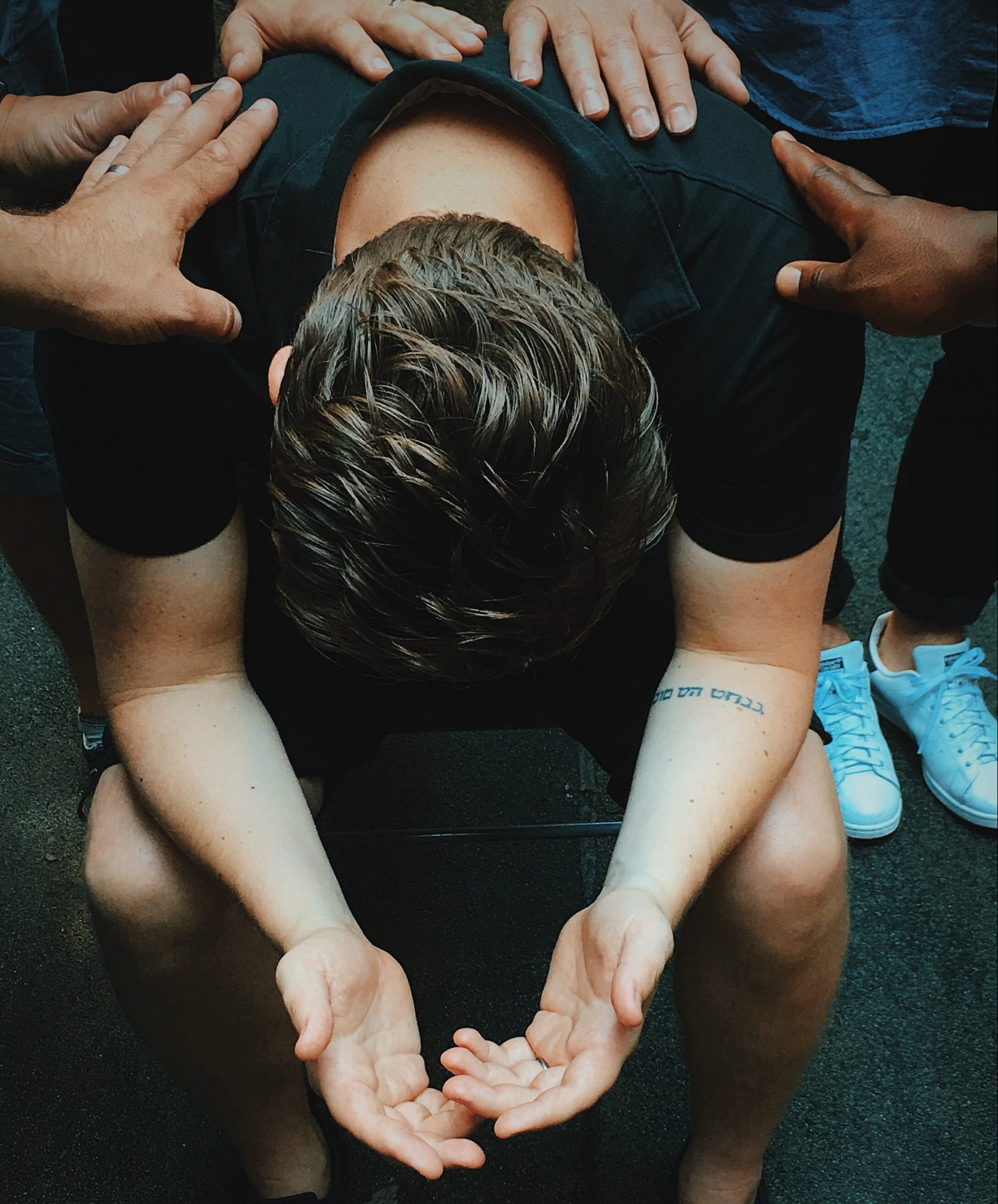 Brothers praying a covering